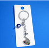 Metal peacock and evil eye charm KEYCHAIN